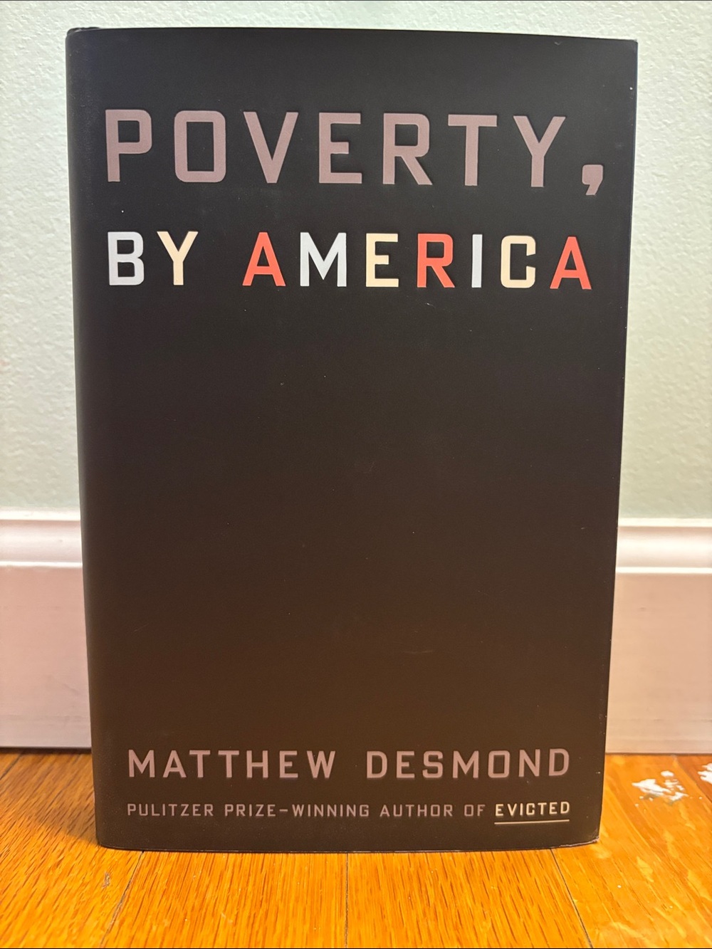 Crown Black and Red "Poverty, By America" Coffee Table Book